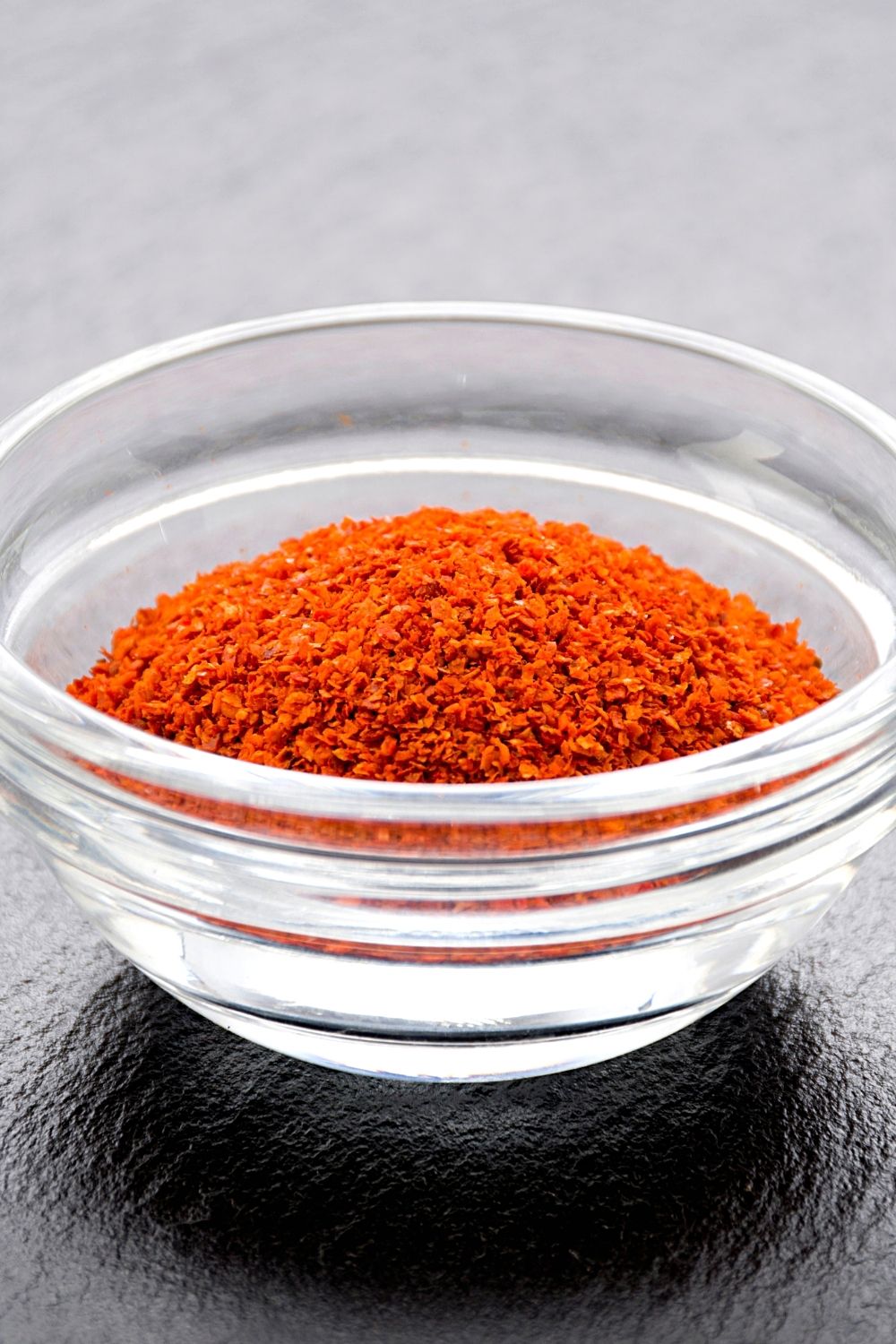 You can sprinkle cayenne pepper powder around the base of your plants to stop cats from eating them